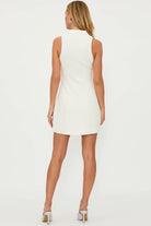 Short ivory dress with gold buttons