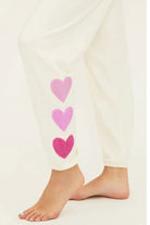Sweatpants with hearts down the left side in cream