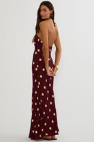 Maxi dress with halter neckline and open back in polka dot print