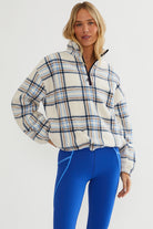 Faux fur pullover sherpa with a quarter zip neckline in plaid