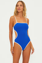 One piece with removable straps and side cutouts in blue with white blocking