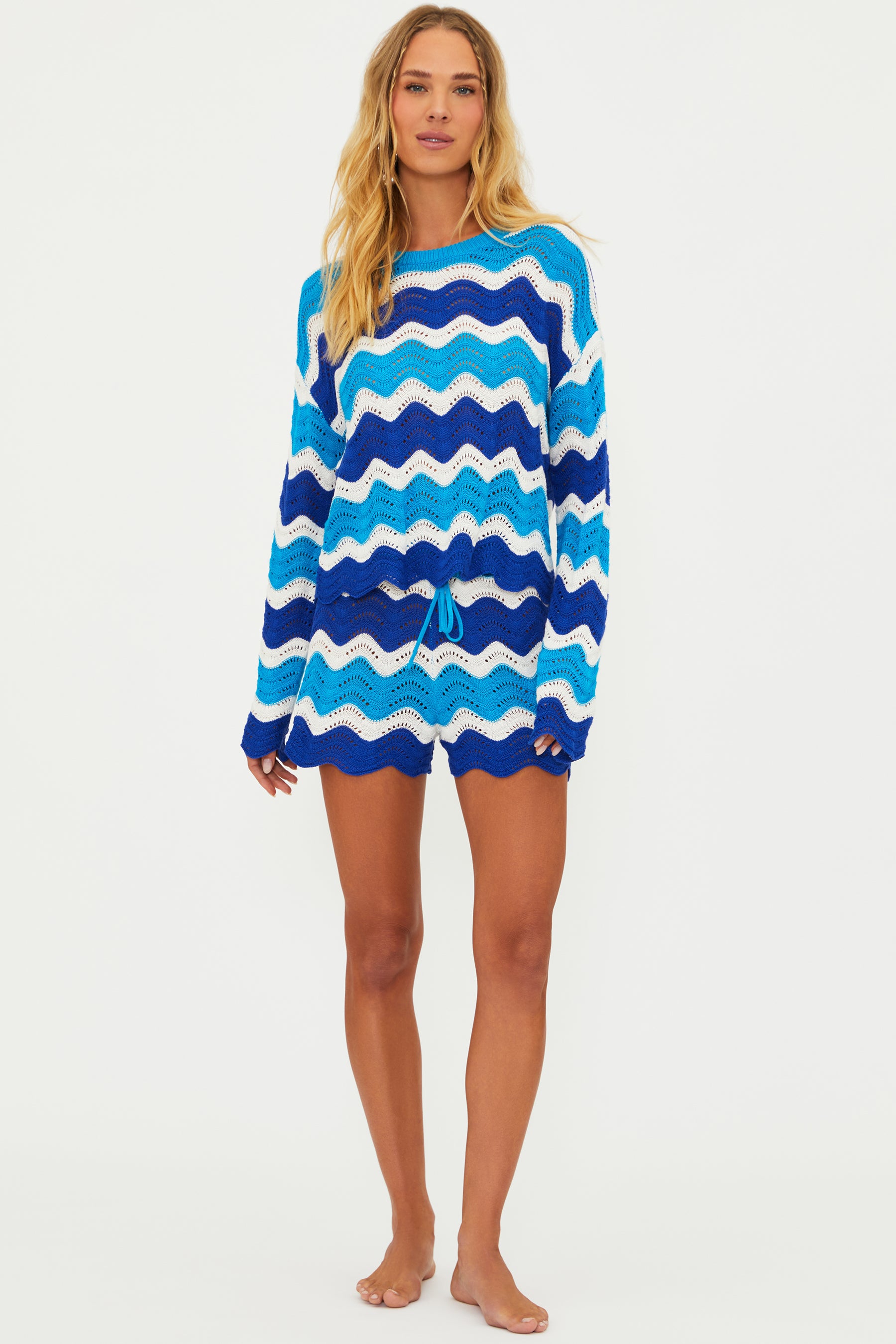 Open knit shorts with drawstring and elastic waistband in blue and turquoise wavy stripes