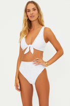 Tie front top with a scooped neck and eyelet embroidery in white