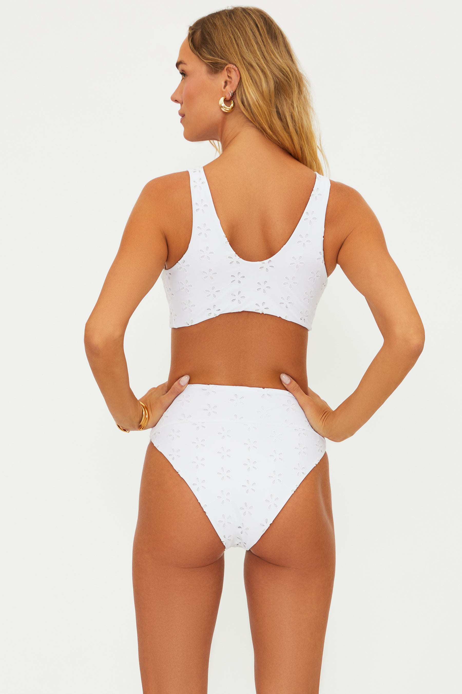 High waist bottoms with embroidered eyelet design in white