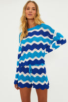 Open knit shorts with drawstring and elastic waistband in blue and turquoise wavy stripes