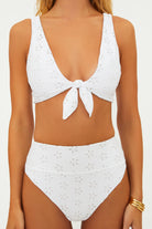 Tie front top with a scooped neck and eyelet embroidery in white