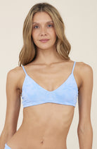Scooped neck top with adjustable straps in light blue with palm tree print