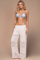 White lace pants with elastic waistband and drawstring