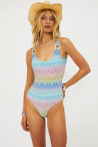 Shimmery scoop neck one piece with square shaped ivory hardware in multicolor pastel print