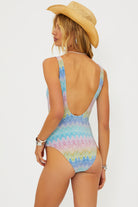 Shimmery scoop neck one piece with square shaped ivory hardware in multicolor pastel print