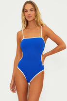 One piece with removable straps and side cutouts in blue with white blocking