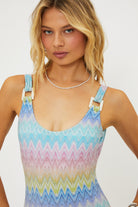 Shimmery scoop neck one piece with square shaped ivory hardware in multicolor pastel print