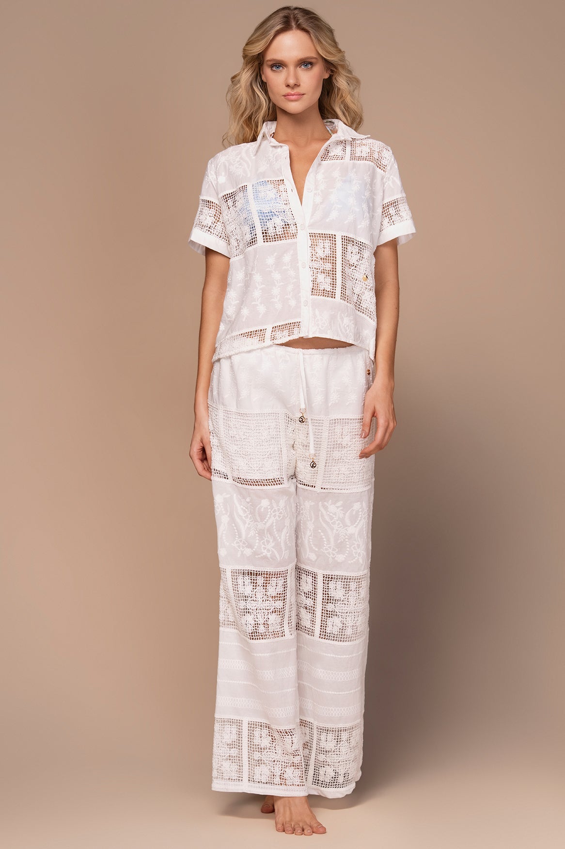 White lace pants with elastic waistband and drawstring