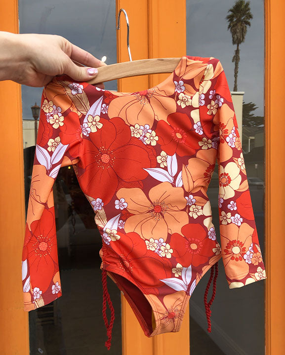 
                  
                    orange flower print long sleeve kids swimsuit 
                  
                